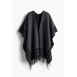 Poncho con borde de flecos
